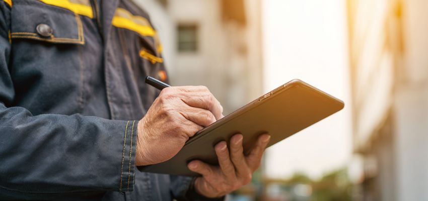 Technician reviewing checklist for annual maintenance contract services