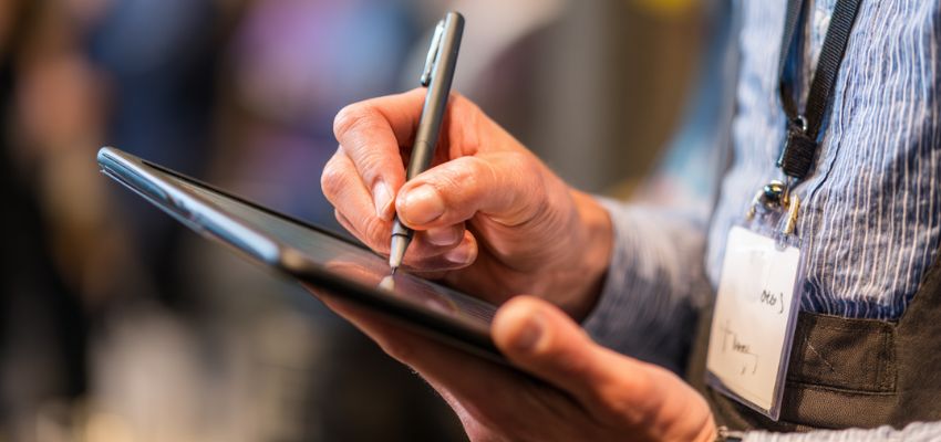 Client reviewing legal paperwork digitally with paperless contract solutions.