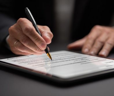 Close-up view of a businessperson finalizing a contract online using an advanced contract tool