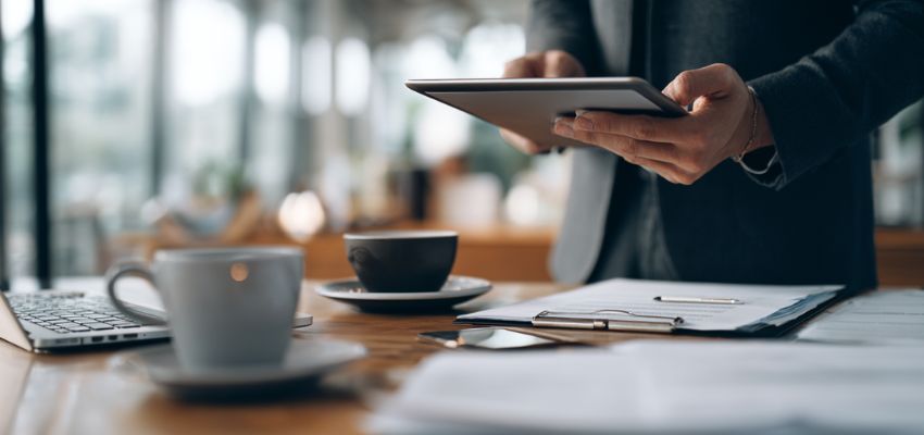 authorized-signatory2 Business professional reviewing and approving documents on a tablet as an authorized signatory.