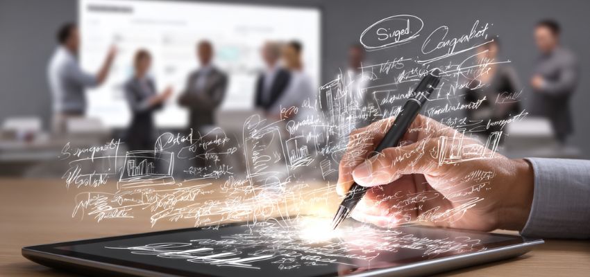 contract-management-platform2 Close-up of a person signing a document on a tablet as the team uses a contract management platform.