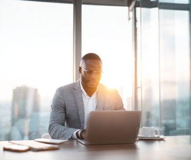 Business professional working on business law contracts in modern office